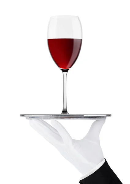 Рука з рукавичкою тримає піднос з червоним келихом вина — стокове фото