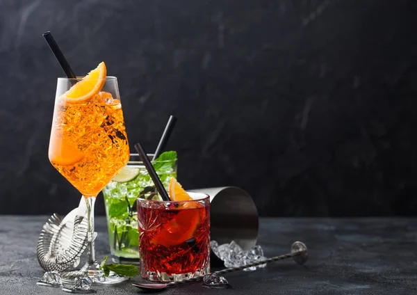 Glasses Spritz Mojito Negroni Cocktails Ice Cubes Lime Orange Slices — Stock Photo, Image