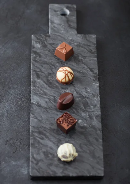 Luxury Chocolate Candies Selection Black Marbel Board White Dark Milk — ストック写真