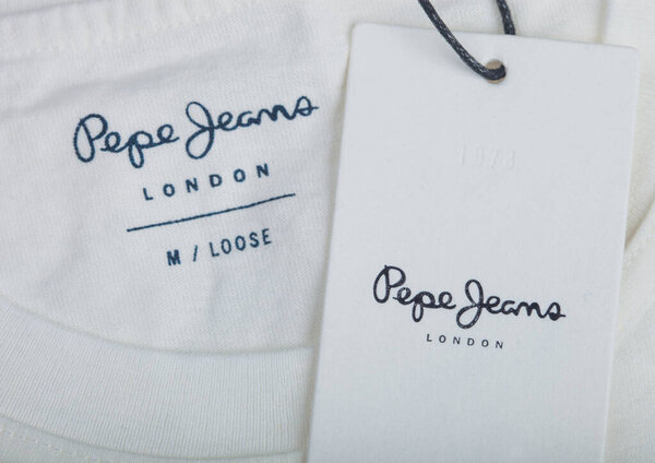 LONDON, UK - SEPTEMBER 09, 2020: Pepe Jeans label and clothing tag on white t-shirt.