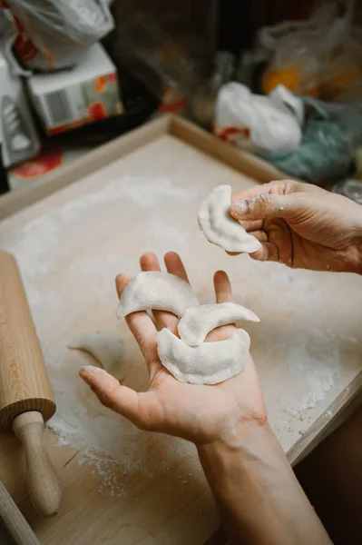 Making of dumplings , cooking at home