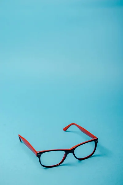 Pair of red plastic-rimmed eyeglasses — Stock Photo, Image