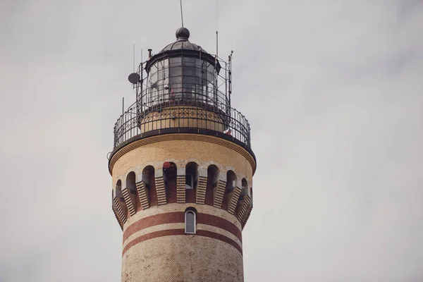 Polish flag hung on at historical lighthouse located in Swinoujscie, Poland, The construction was build in 1828 and height is 65 meters. 19th century. Top tallest Lighthouse in the World