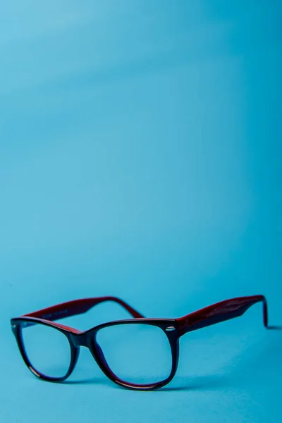 Pair Red Plastic Rimmed Eyeglasses Blue Background — Stock Photo, Image