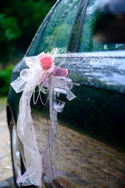 Luxury wedding car decorated with beautiful flowers. Brides and grooms wedding day