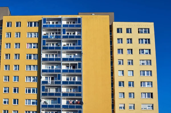 The facade of a residential high-rise building in Poznan