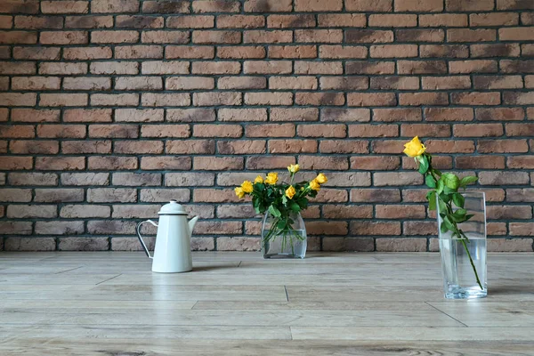 Glass Vases Yellow Roses Jug Background Red Brick Wall — Stock Photo, Image