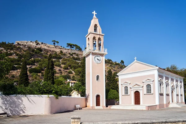 Orthodox church with a bell tower and a Venetian fortress on a hill on the island of Kefalonia, Greece