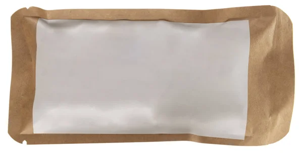Sealed craft paper food, coffee, tea pack with blank white sticker isolated on white. Enviromental friendly package