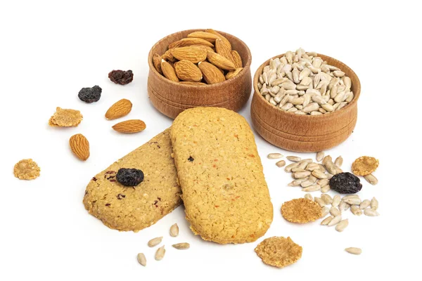 Almonds, seeds and raisins in a wooden bowls. — Stock Photo, Image