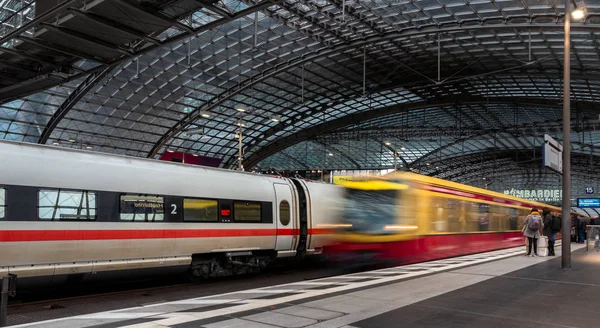 Trains, travelers and others at and in the berlin main station, germany — Stock Photo, Image