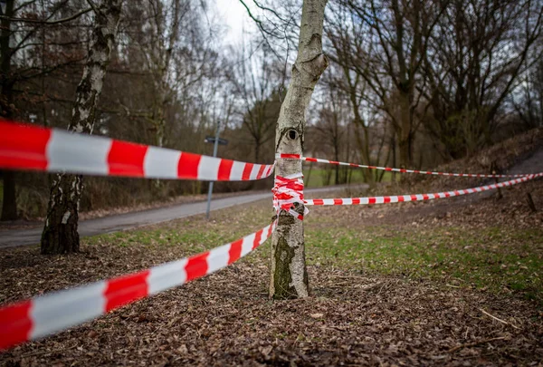Red and white barrier tape at a police crime scene, berlin, germany — Stock Photo, Image