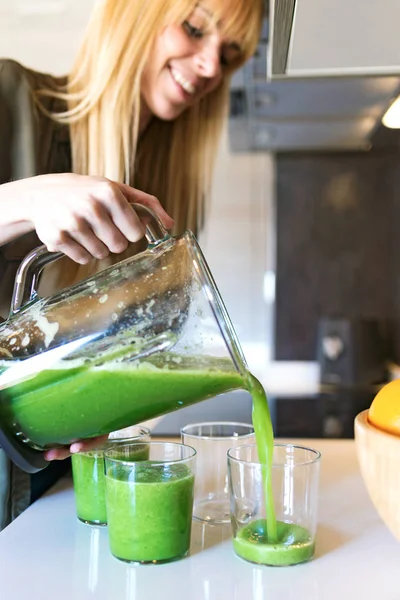 Shot Beautiful Young Woman Serving Detox Green Juice Glasses Home — Stock Photo, Image