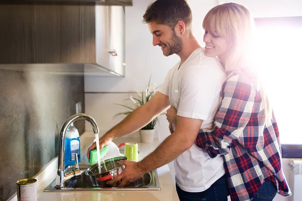 Shot Beautiful Young Couple Having Fun Cleaning Kitchen Utensils Home — Stock Photo, Image