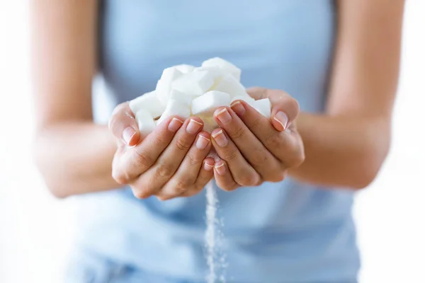 White sugar cubes in the woman hands. Heap of white sugar. — Stock Photo, Image