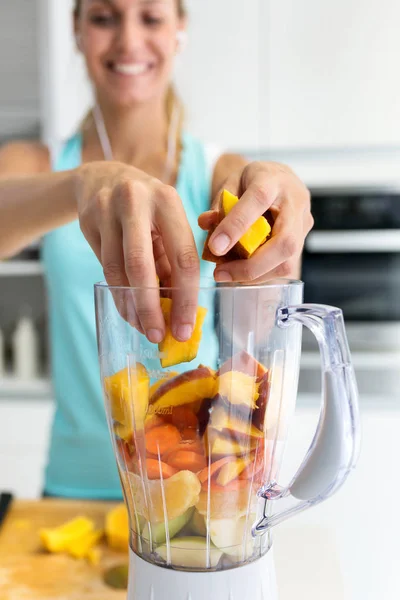 Close Sporty Young Woman Making Vegetable Smoothie While Listening Music — Stock Photo, Image