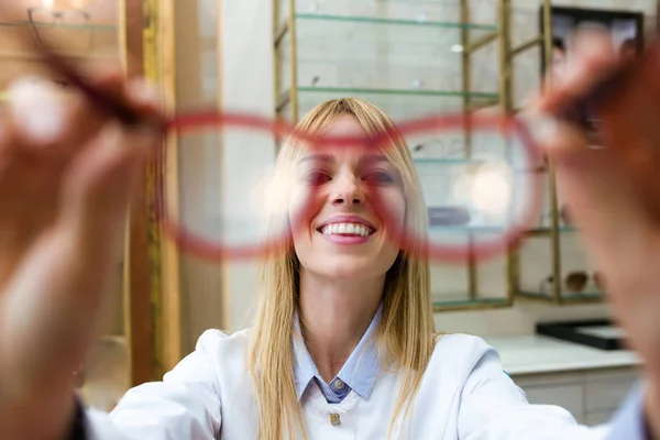 Shot Beautiful Young Ophthalmologist Holding Eyeglasses Prove Customer Optic Shop — Stock Photo, Image