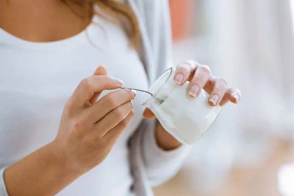 Close Woman Hand Holding Yogurt While Eating Home — Stock Photo, Image