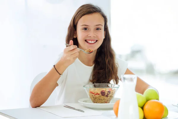 Portrait Pretty Little Girl Eating Cereals Smiling Camera Kitchen Home — Stock Photo, Image