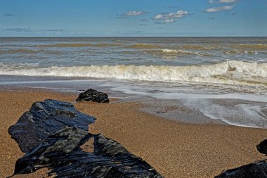 Lincolnshire, UK, beach with rocks and sea clipart