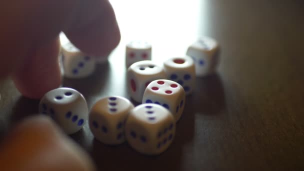 Finger tapping on table with dice on — Stock Video