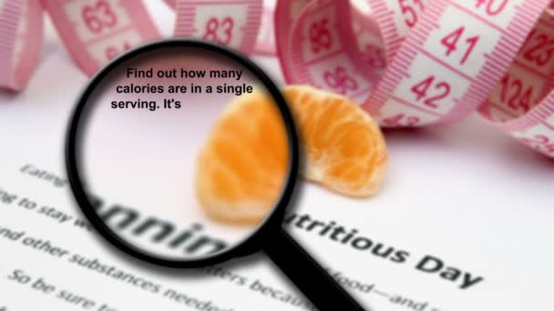 Magnifying glass on nutrition facts — Stock Video