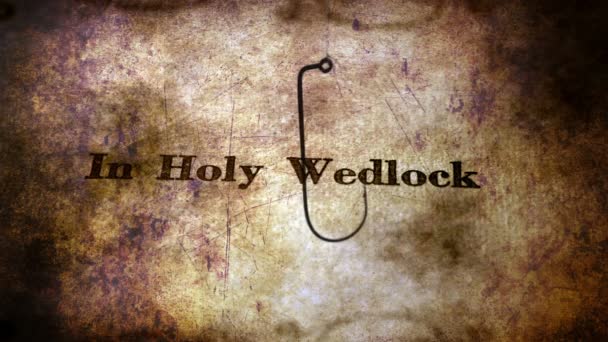 Fish hook against holy wedlock  bait concept — Stock Video