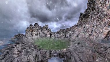 Kayalık dağın tepesine yağan kar suya yansıyor