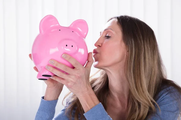 Side View Mature Woman Kissing Piggybank Blinds — Stock Photo, Image