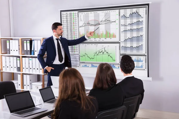 Young Male Stock Market Broker Giving Presentation His Partners Projector — Stock Photo, Image