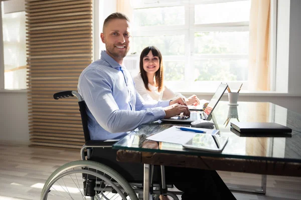 Portrait Smiling Disabled Businessman His Colleague Working Laptop — Stock Photo, Image