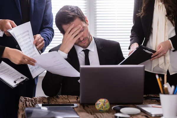 Stressed Businessman Sitting Office Surrounded Businesspeople — Stock Photo, Image