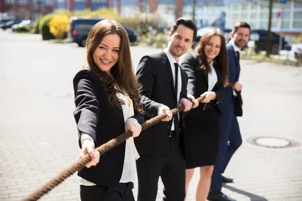 Group Happy Young Businesspeople Pulling Rope — Stock Photo, Image