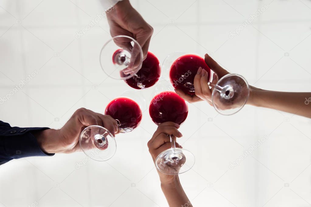 Close-up Of Friends Toasting Wineglasses At Party