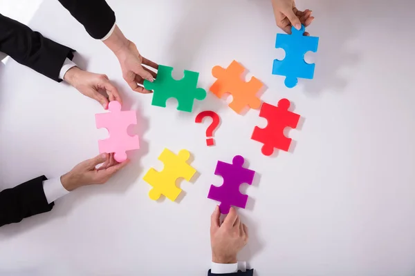 Group Businesspeople Holding Jigsaw Puzzle Question Mark White Background — Stock Photo, Image