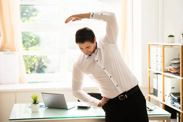 Young Businessman Doing Stretching Exercise Workplace — Stock Photo, Image