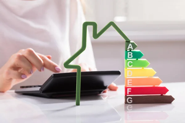 Close House Showing Energy Efficiency Rate Front Businesswoman Using Calculator — Stock Photo, Image