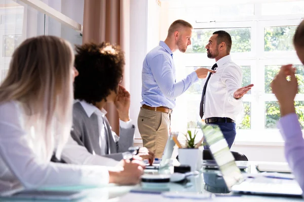 Stressed Businesspeople Sitting Front Two Colleagues Fighting Office — Stock Photo, Image