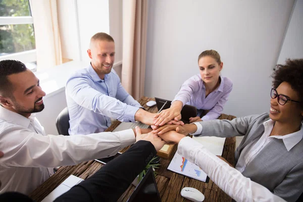 Group Smiling Young Businesspeople Stacking Hands Office — Stock Photo, Image
