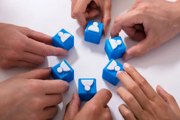 Businesspeople Holding Blue Cubic Blocks Human Figures White Background — Stock Photo, Image