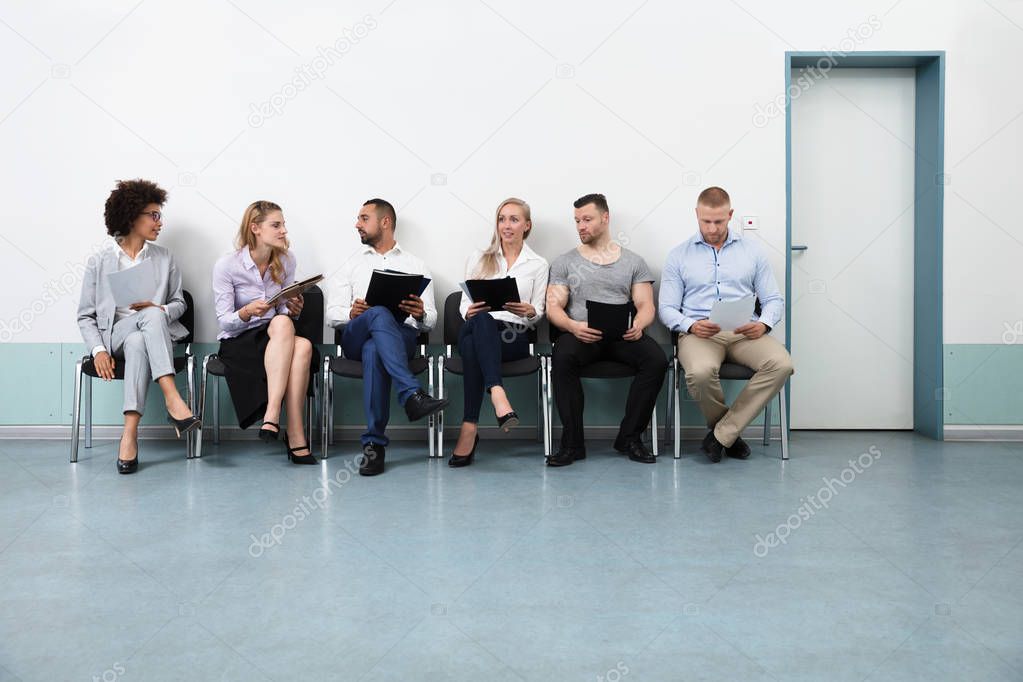 Candidates Sitting On Chair Waiting For An Interview