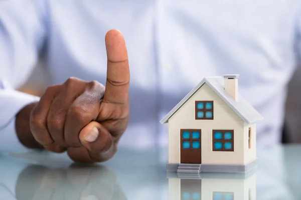 Close Person Hand Pointing Upward Miniature House Desk — Stock Photo, Image