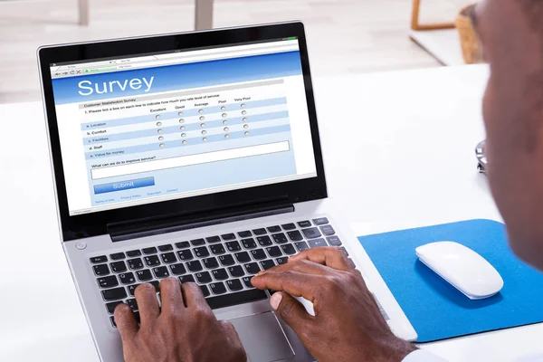Close Man Filling Survey Form Laptop Workplace — Stock Photo, Image