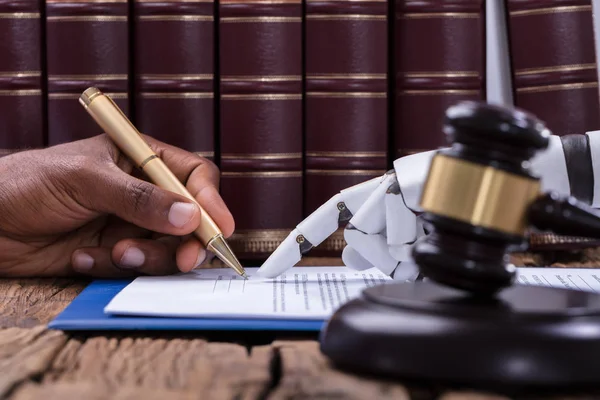 Robotic Hand Assisting Person Signing Document Courtroom — Stock Photo, Image