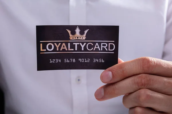 Close Businessman Hand Holding Loyalty Card — Stock Photo, Image