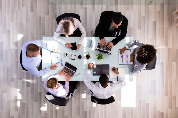 Elevated View Businesspeople Working Graphs Office — Stock Photo, Image