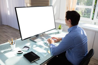 Businessman using computer with blank white screen clipart