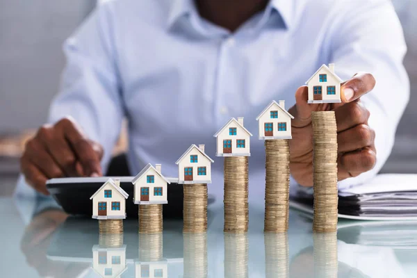 Close Business Person Placing Miniature House Model Stacked Coins — Stock Photo, Image