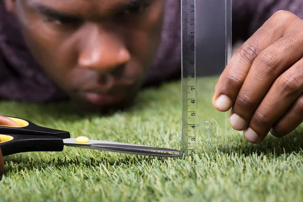 Close Man Cutting Green Grass Measured Ruler — Stock Photo, Image