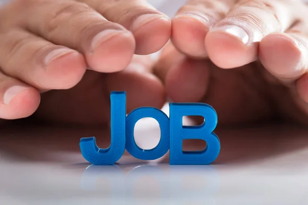 Businessperson Hand Protecting Blue Job Word Table — Stock Photo, Image